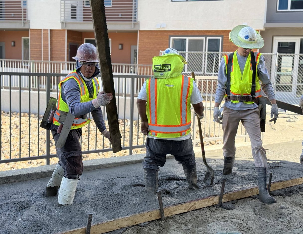 men working on a concrete site